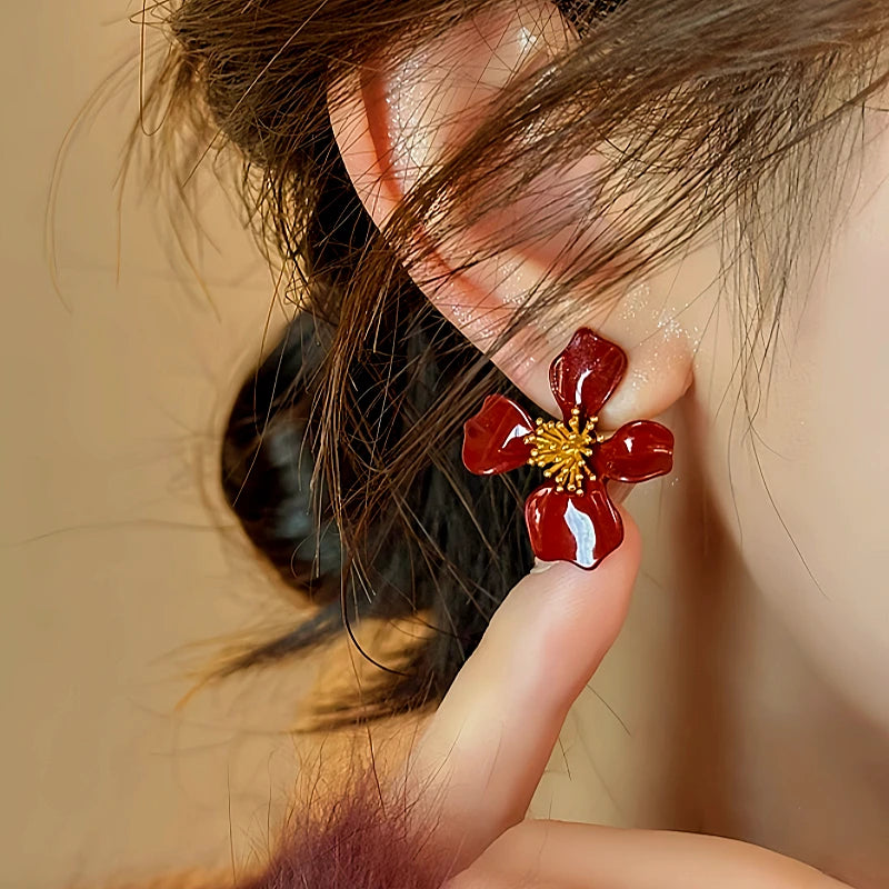 Angled view of the 14K Gold-Plated Elegant Red Petal Flower Earrings