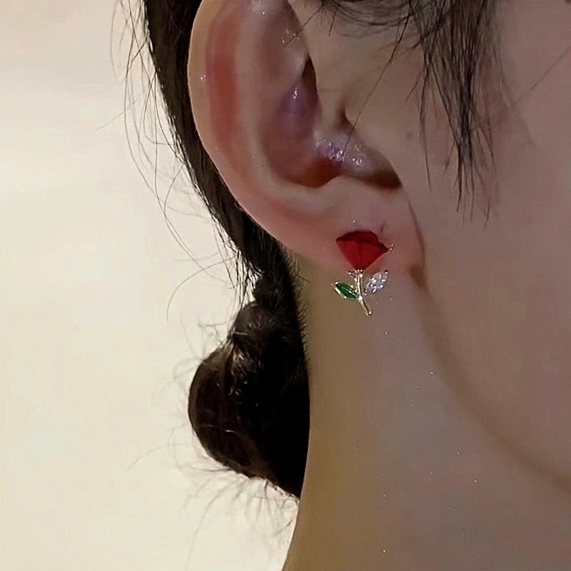 Angled view of the 14K Gold-Plated Elegant Red Rose Stud Earrings
