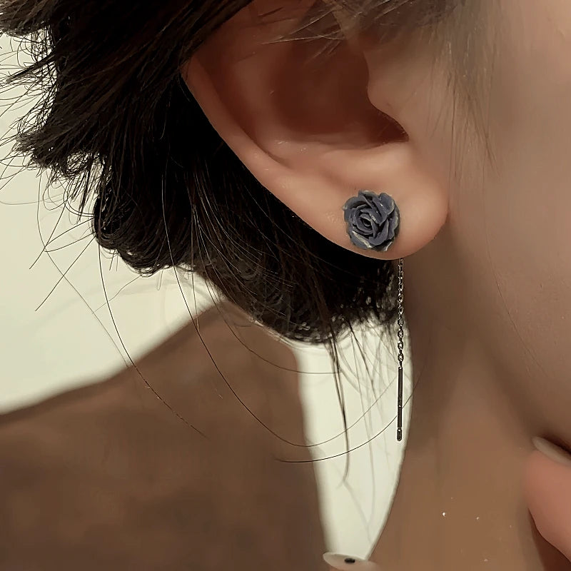Close-up detail of the sparkling zircons and plating on the Black Flower Threader Earrings
