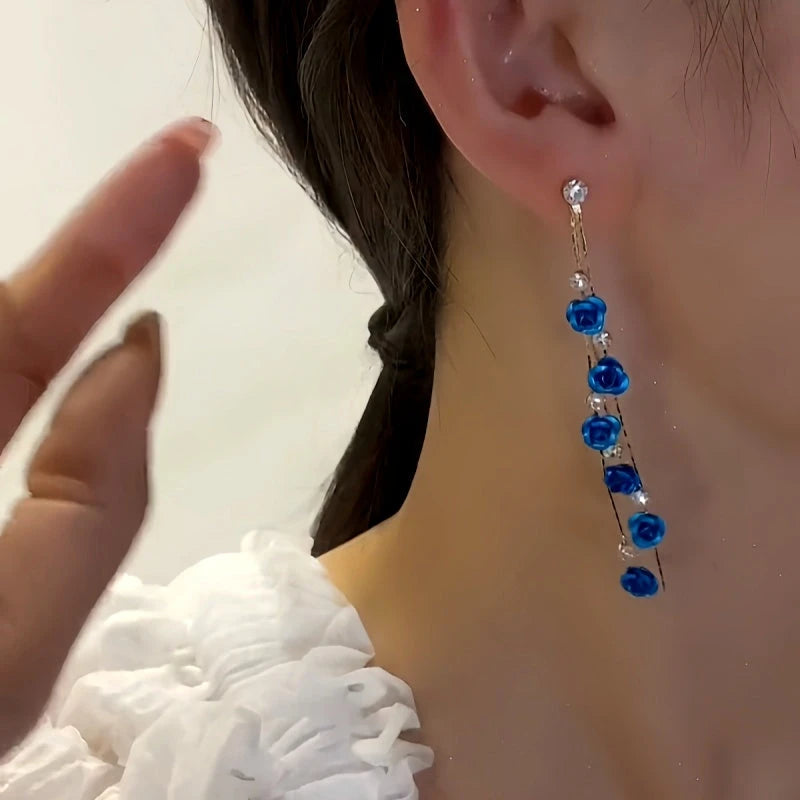 Close-up detail of the sparkling zircons and plating on the Blue Rose Tassel Earrings