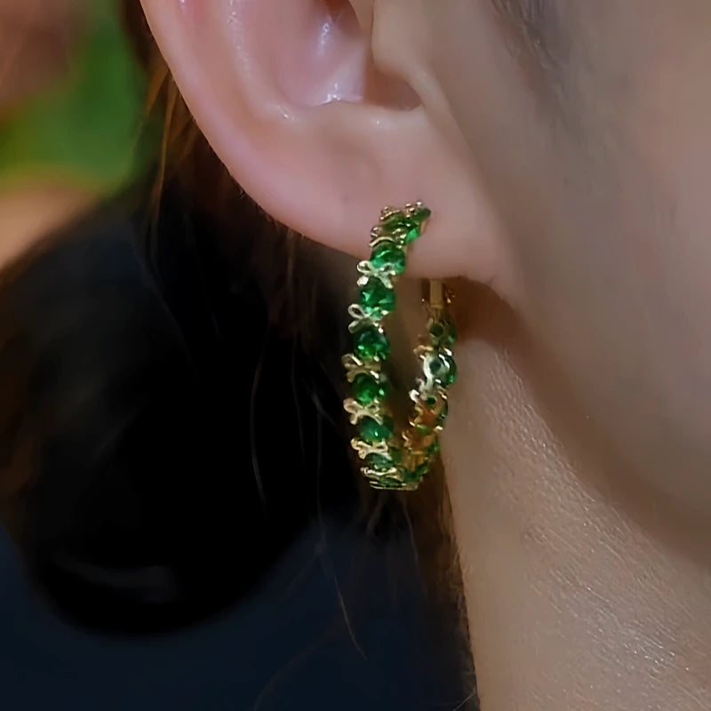 Close-up detail of the sparkling zircons and plating on the Bow Hoop Earrings