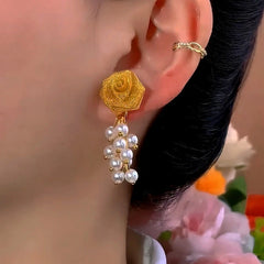 Close-up detail of the sparkling zircons and plating on the Rose Tassel Earrings