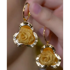 Close-up detail of the sparkling zircons and plating on the Rose Pendant Earrings