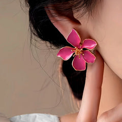 Model showcasing the dangle and style of the 14K Gold-Plated Elegant Rose Pink Flower Earrings