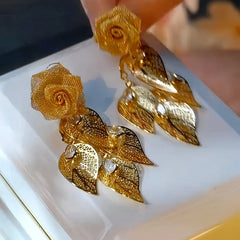 Close-up detail of the sparkling zircons and plating on the Feather Tassel Earrings