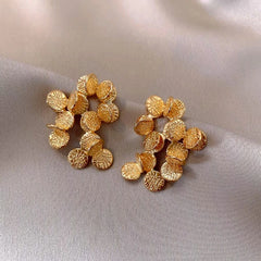 Close-up detail of the sparkling zircons and plating on the Leaf Tassel Earrings