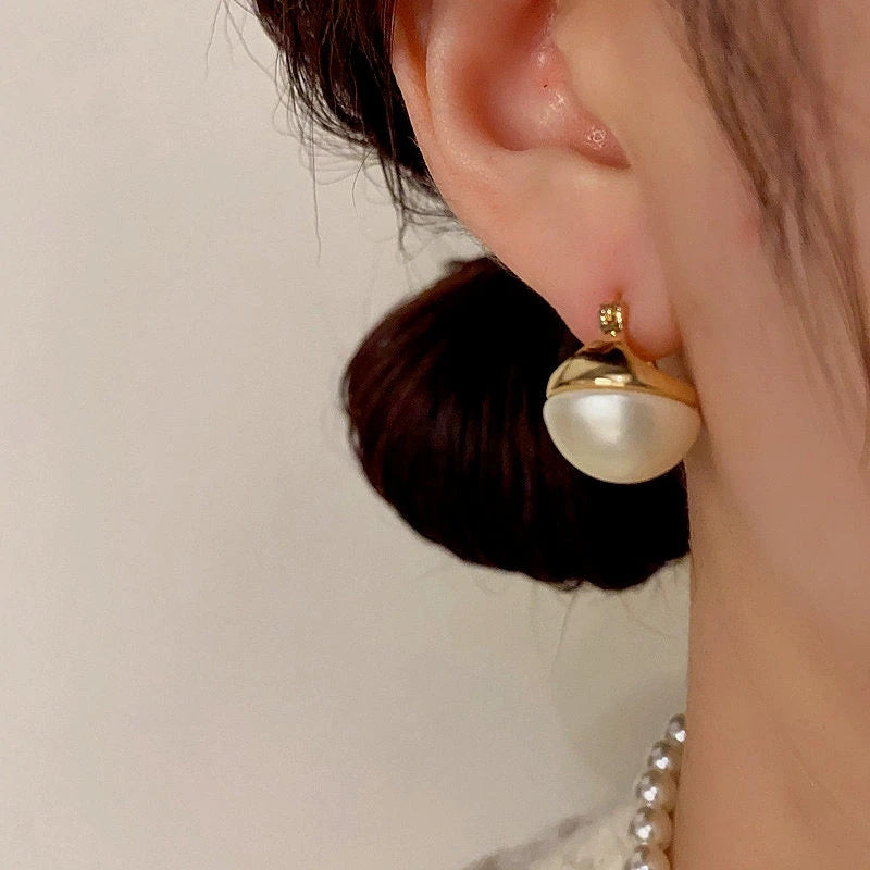 Close-up detail of the sparkling zircons and plating on the Round Pearl Earrings