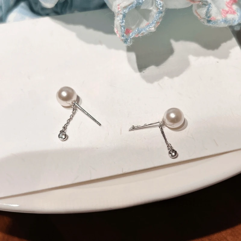 Angled view of the 14K Gold-Plated Elegant Short Chain Pearl Earrings