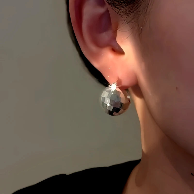 Close-up detail of the sparkling zircons and plating on the Basket Earrings