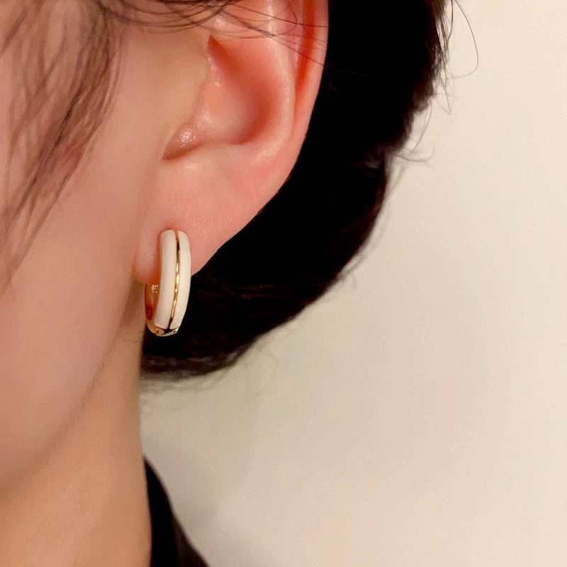 Angled view of the 14K Gold-Plated Elegant Simple And Gentle Drip Glaze Heart Earrings