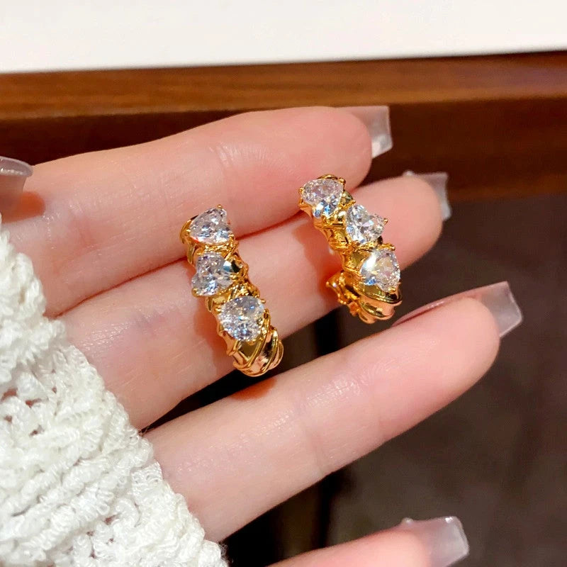 Close-up detail of the sparkling zircons and plating on the Zircon Heart Hoops