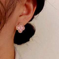 Model showcasing the dangle and style of the 14K Gold-Plated Elegant Simple Flower Stud Earrings