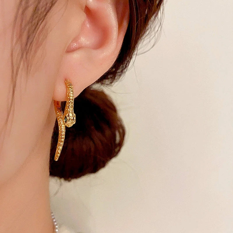 Close-up detail of the sparkling zircons and plating on the Snake Shaped Earrings