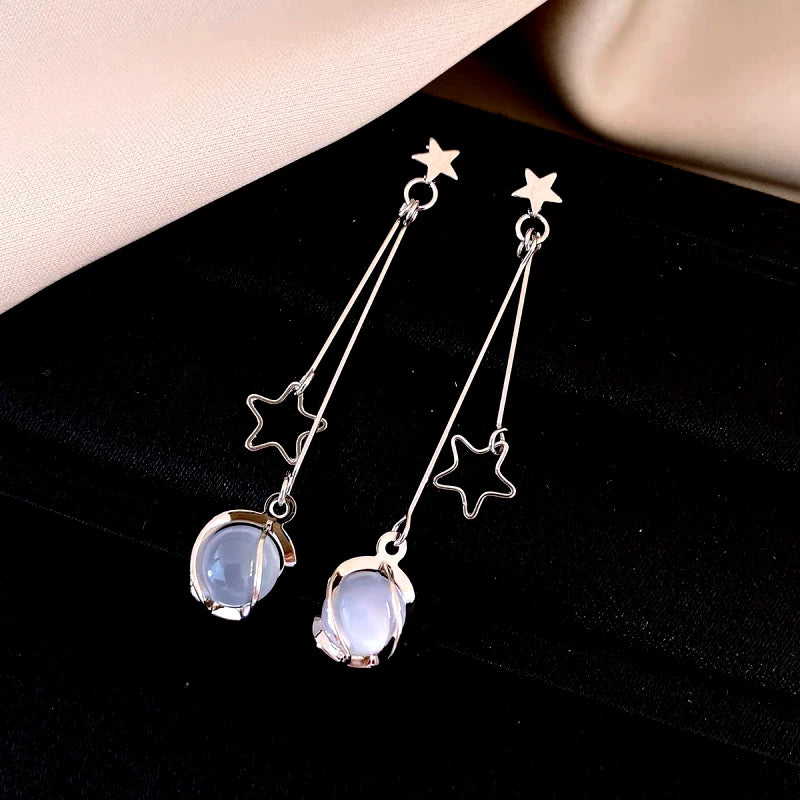 Angled view of the 14K Gold-Plated Elegant Star Cat's Eye Bead Tassel Earrings