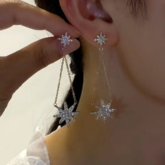 Close-up detail of the sparkling zircons and plating on the Star Tassel Earrings