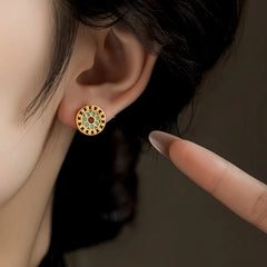 Model showcasing the dangle and style of the 14K Gold-Plated Elegant Studs