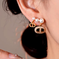 Model showcasing the dangle and style of the 14K Gold-Plated Elegant Sweet Pearl Tassel Earrings