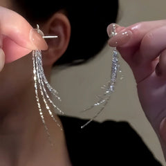 Angled view of the 14K Gold-Plated Elegant Tassel Earrings