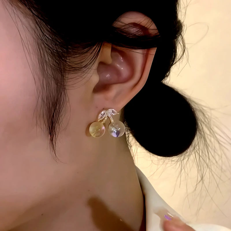 Close-up detail of the sparkling zircons and plating on the Cherry Earrings