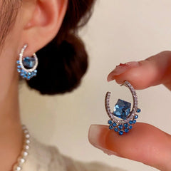 Close-up detail of the sparkling zircons and plating on the U-Shaped Earrings