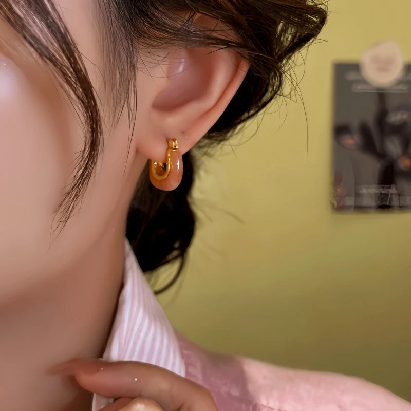 Close-up detail of the sparkling zircons and plating on the Pink U-Shaped Earrings