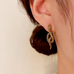 Close-up detail of the sparkling zircons and plating on the Black Snake Earrings