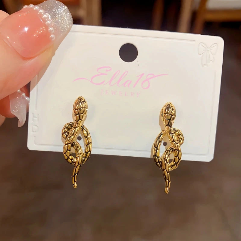 Angled view of the 14K Gold-Plated Elegant Vintage Black Metal Snake Earrings