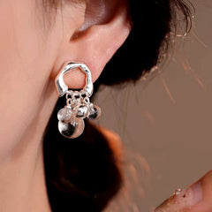 Model showcasing the dangle and style of the 14K Gold-Plated Elegant Water Drop Earrings