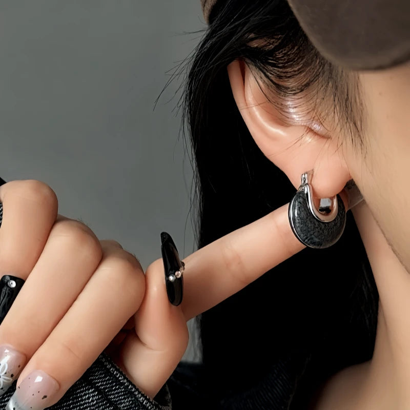 Model showcasing the dangle and style of the 14K Gold-Plated Elegant Water Drop Earrings