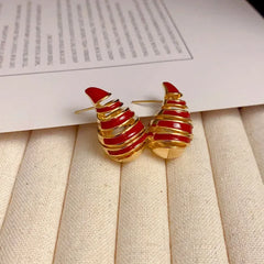 Close-up detail of the sparkling zircons and plating on the Spiral Drop Earrings