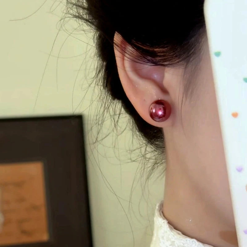 Close-up detail of the sparkling zircons and plating on the Red Bead Studs