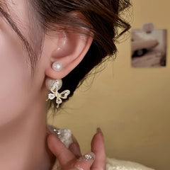 Close-up detail of the sparkling zircons and plating on the Butterfly Jacket Earrings
