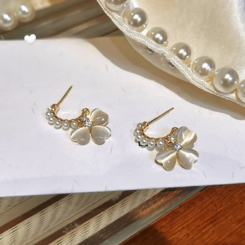Angled view of the 14K Gold-Plated Elegant Zircon Bead Cat's Eye Stone Flower Earrings