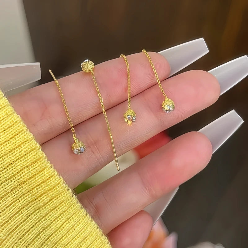 Close-up detail of the sparkling zircons and plating on the Bean Threader Earrings