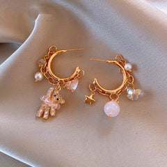 Close-up detail of the sparkling zircons and plating on the Bear Tassel Earrings