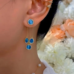 Close-up detail of the sparkling zircons and plating on the Cat's Eye Tassel Earrings