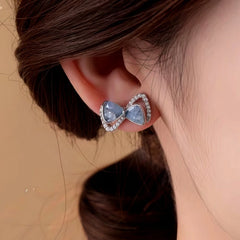 Close-up detail of the sparkling zircons and plating on the Blue Bow Studs