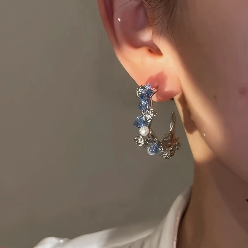 Close-up detail of the sparkling zircons and plating on the Blue Crystal Hoops