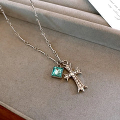 14K Gold-Plated Elegant Zircon Blue Diamond Cross Pendant Necklace worn to showcase its length and pendant detail