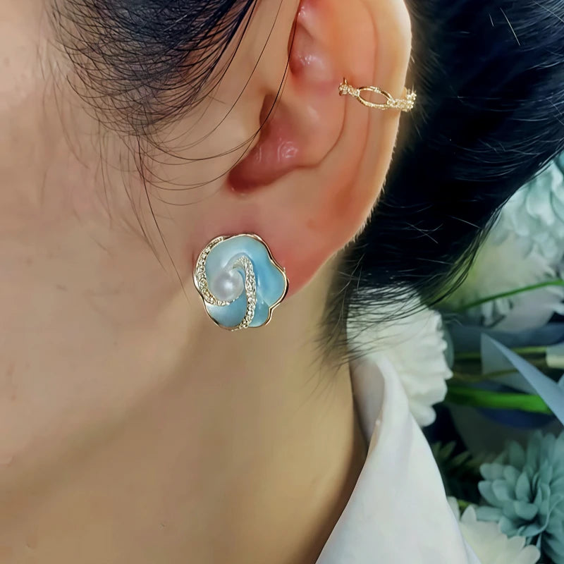 Close-up detail of the sparkling zircons and plating on the Blue Flower Studs