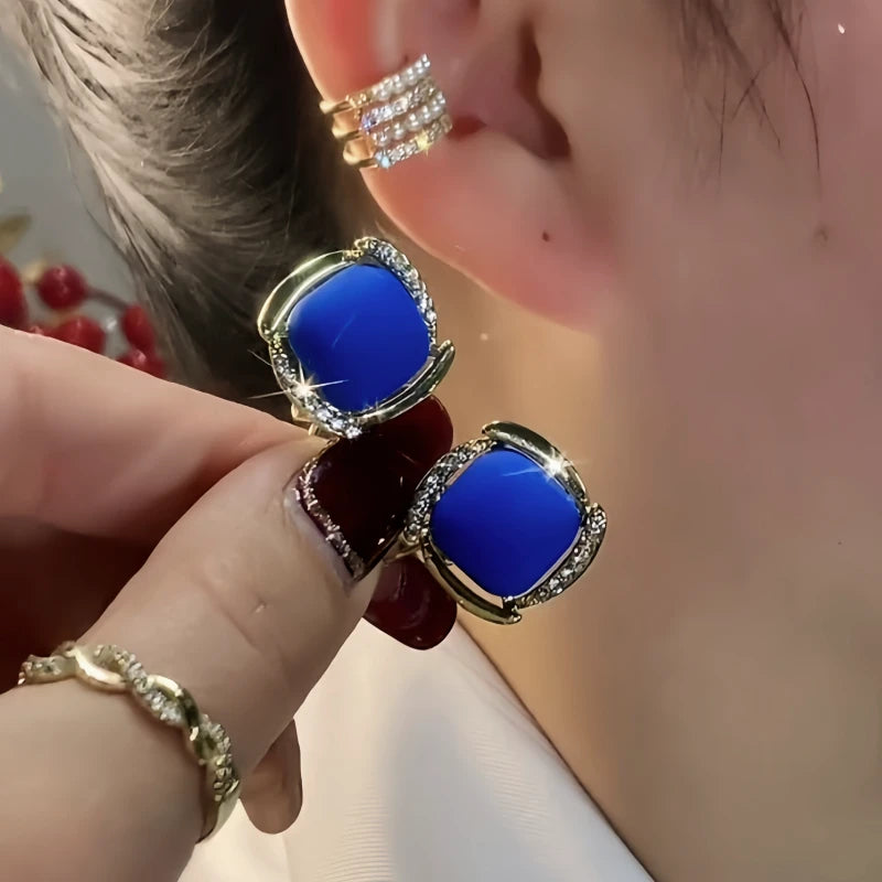 Angled view of the 14K Gold-Plated Elegant Zircon Blue Square Stud Earrings