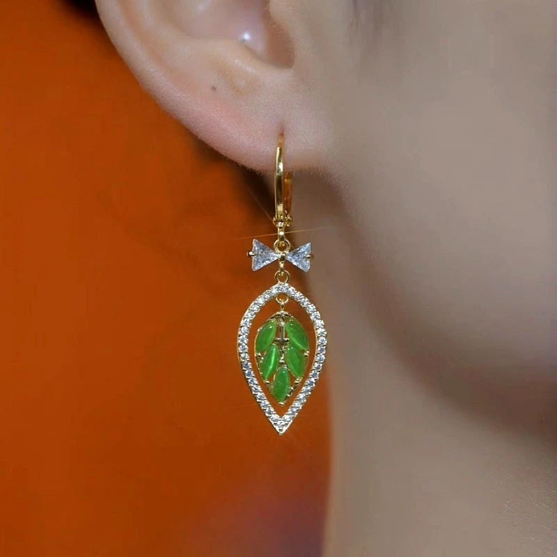 Close-up detail of the sparkling zircons and plating on the Green Leaf Earrings