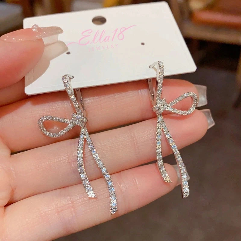 Close-up detail of the sparkling zircons and plating on the Bow Tassel Earrings