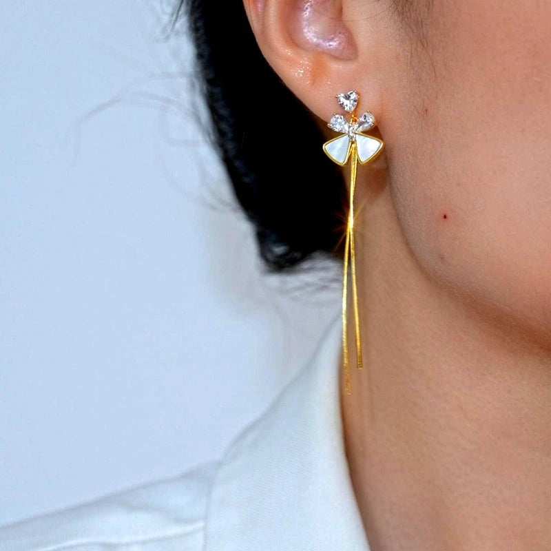 Close-up detail of the sparkling zircons and plating on the Bow Tassel Earrings