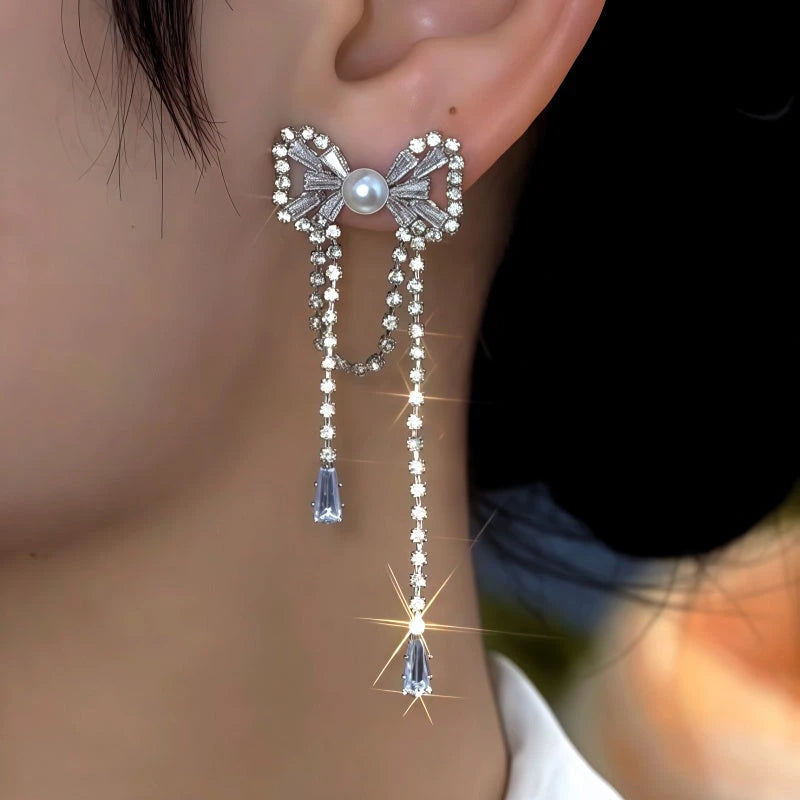 Close-up detail of the sparkling zircons and plating on the Bow Tassel Earrings