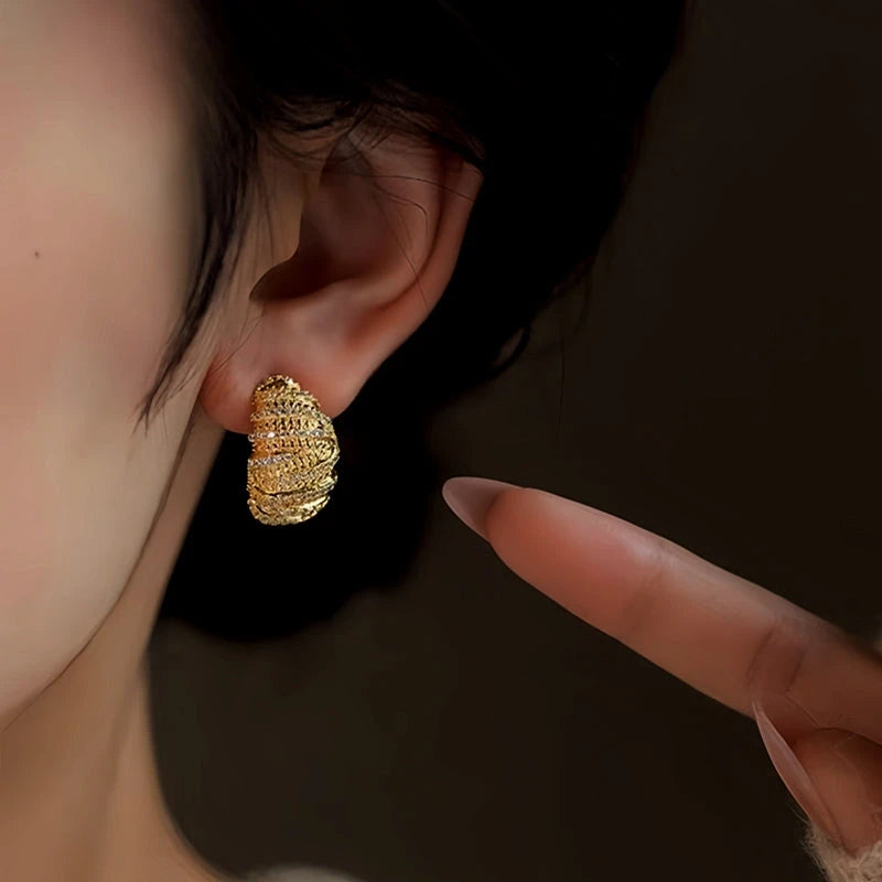 Model showcasing the dangle and style of the 14K Gold-Plated Elegant Zircon Bread Earrings