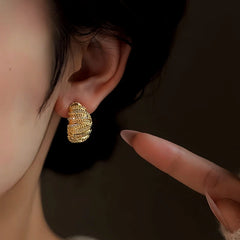 Model showcasing the dangle and style of the 14K Gold-Plated Elegant Zircon Bread Earrings