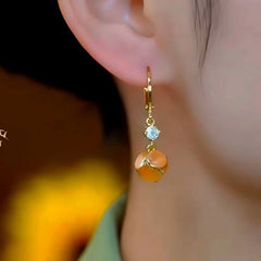 Close-up detail of the sparkling zircons and plating on the Brown Cat's Eye Earrings