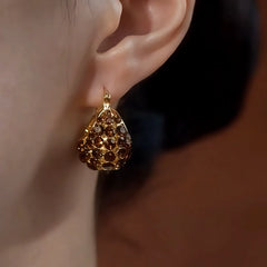 Close-up detail of the sparkling zircons and plating on the Handbag Earrings