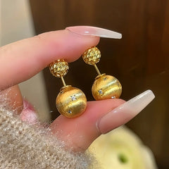 Close-up detail of the sparkling zircons and plating on the Bead Jacket Earrings